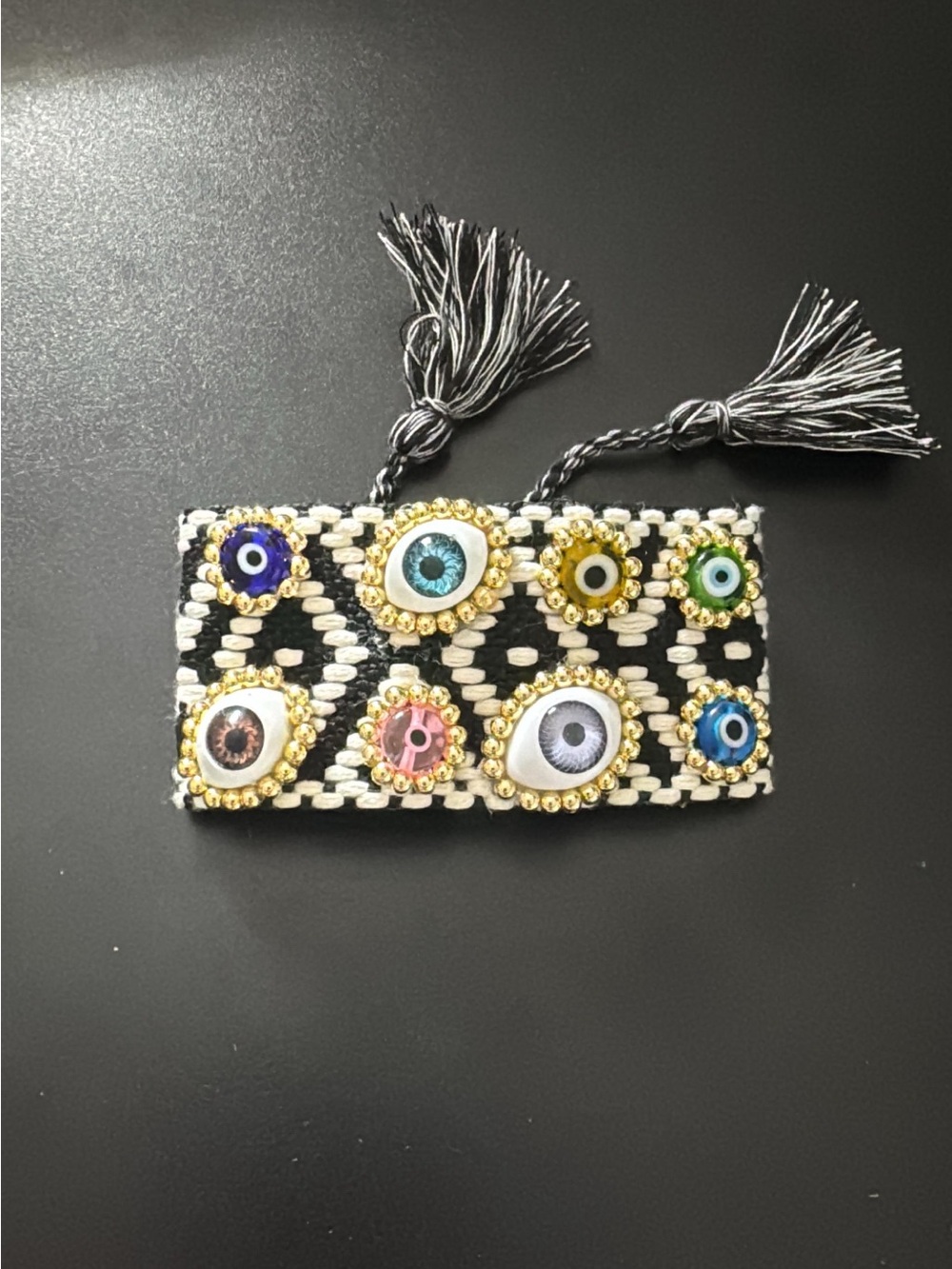 Embellished Black & White Woven Wristlet with Multicolor Eye Accents
